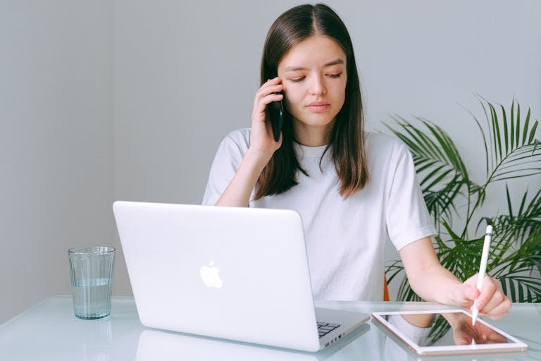 recruiter scanning LinkedIn profiles on laptop